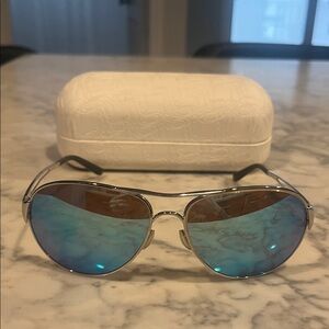 Oakley Aviator Sunglasses with Silver Frame and Blue Lenses